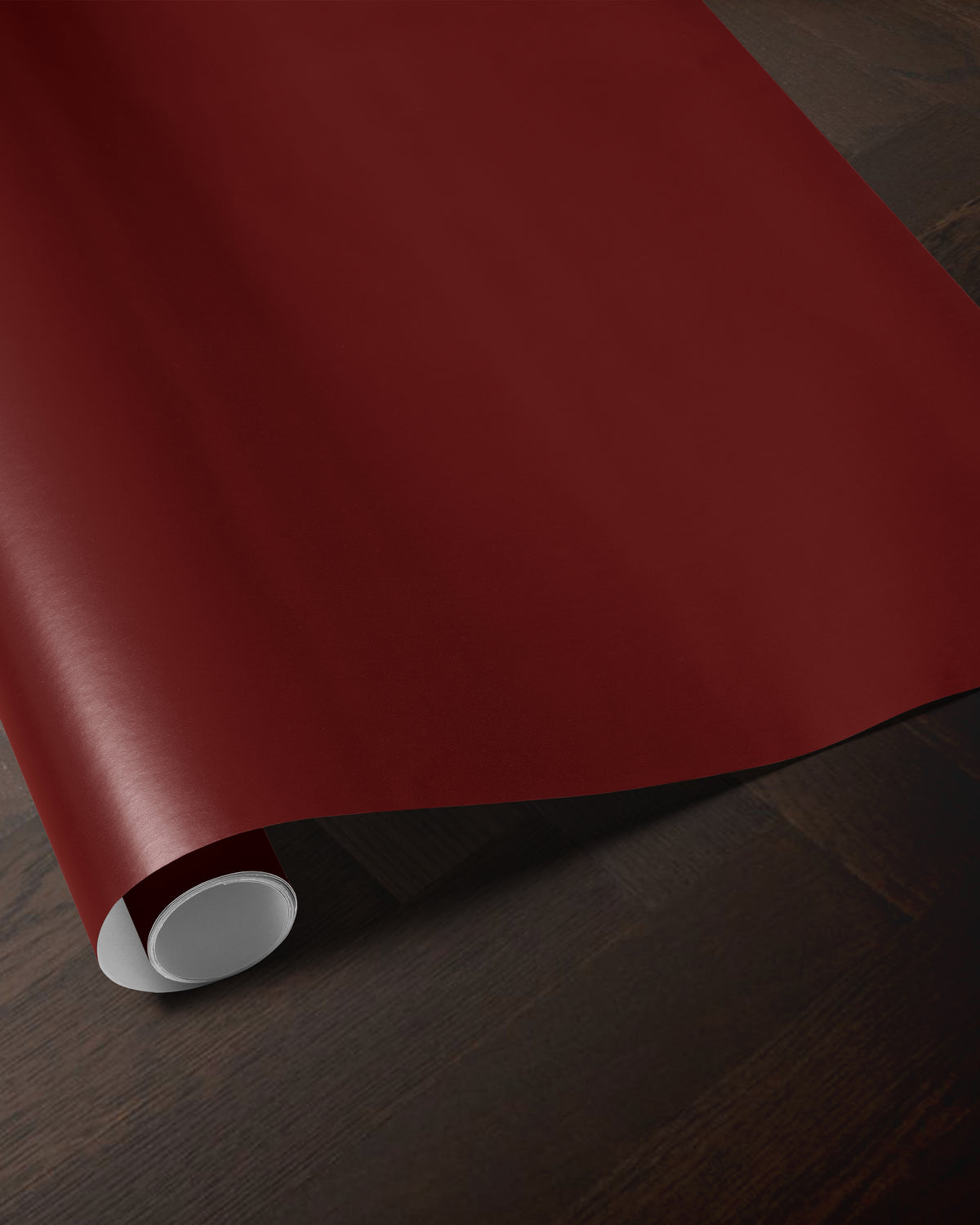 Wine red wrapping paper roll showing the rich solid red color and smooth paper finish