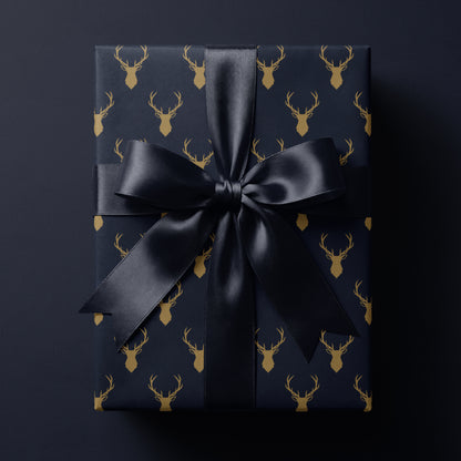 blue reindeer wrapping paper featuring elegant golden antlers
