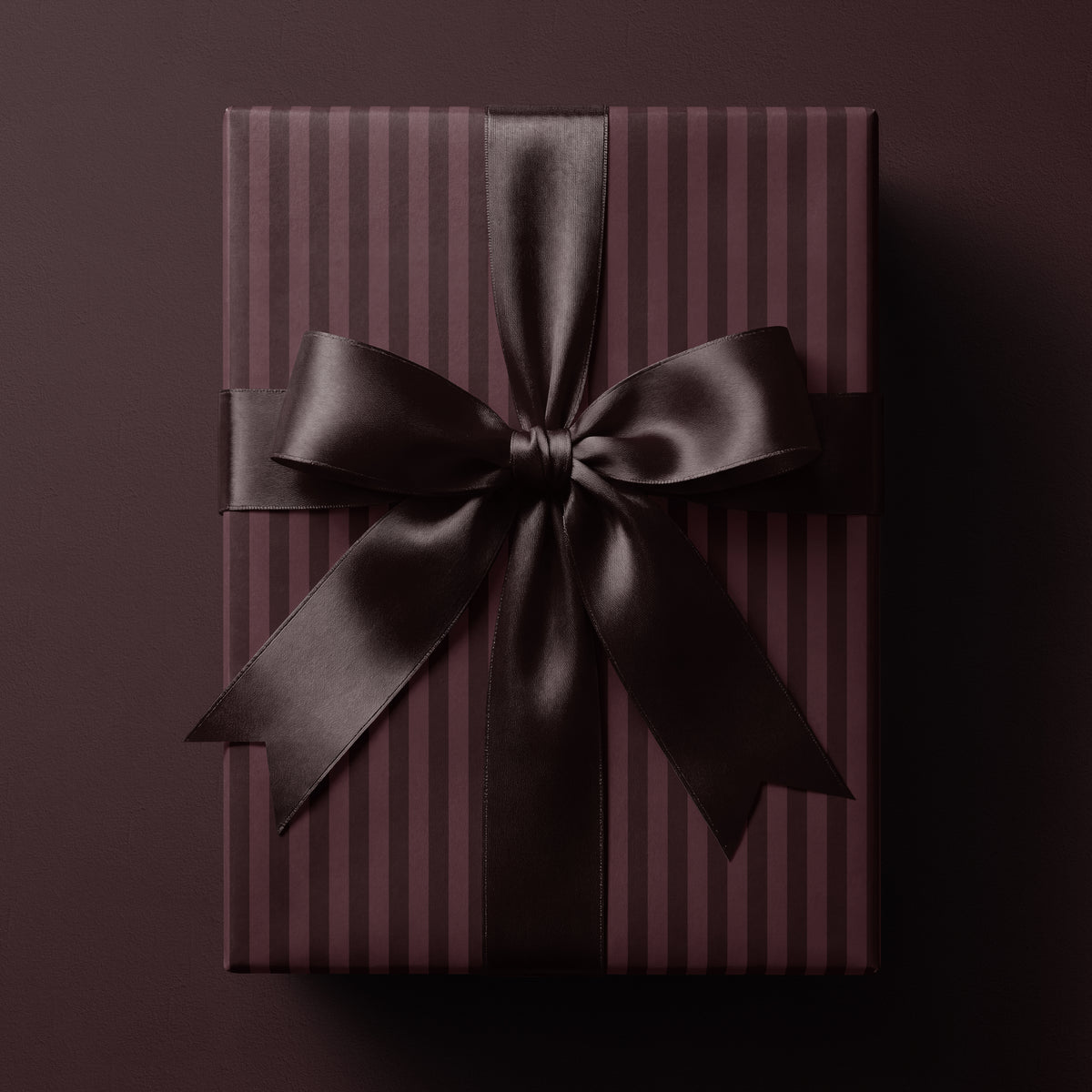 Burgundy striped wrapping paper featuring classic vertical stripes in rich wine-red tones