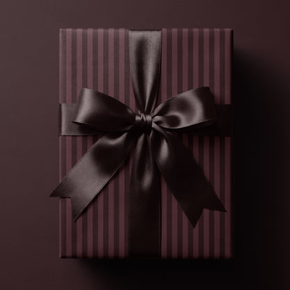 Burgundy striped wrapping paper featuring classic vertical stripes in rich wine-red tones