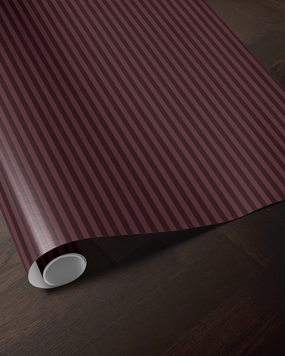 Burgundy striped wrapping paper roll showing the classic vertical stripe pattern