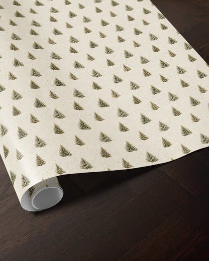 Snowy Christmas tree wrapping paper roll showing the detailed pine tree pattern