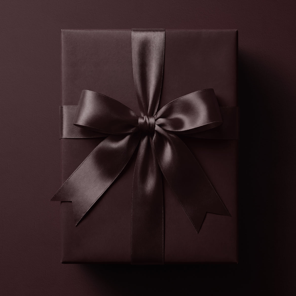 Solid dark burgundy wrapping paper in a rich deep burgundy tone by Mahomi Design