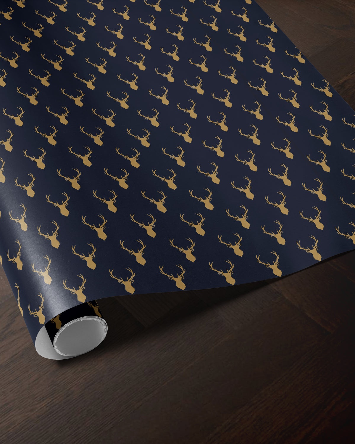 blue reindeer wrapping paper roll with a golden antler pattern

