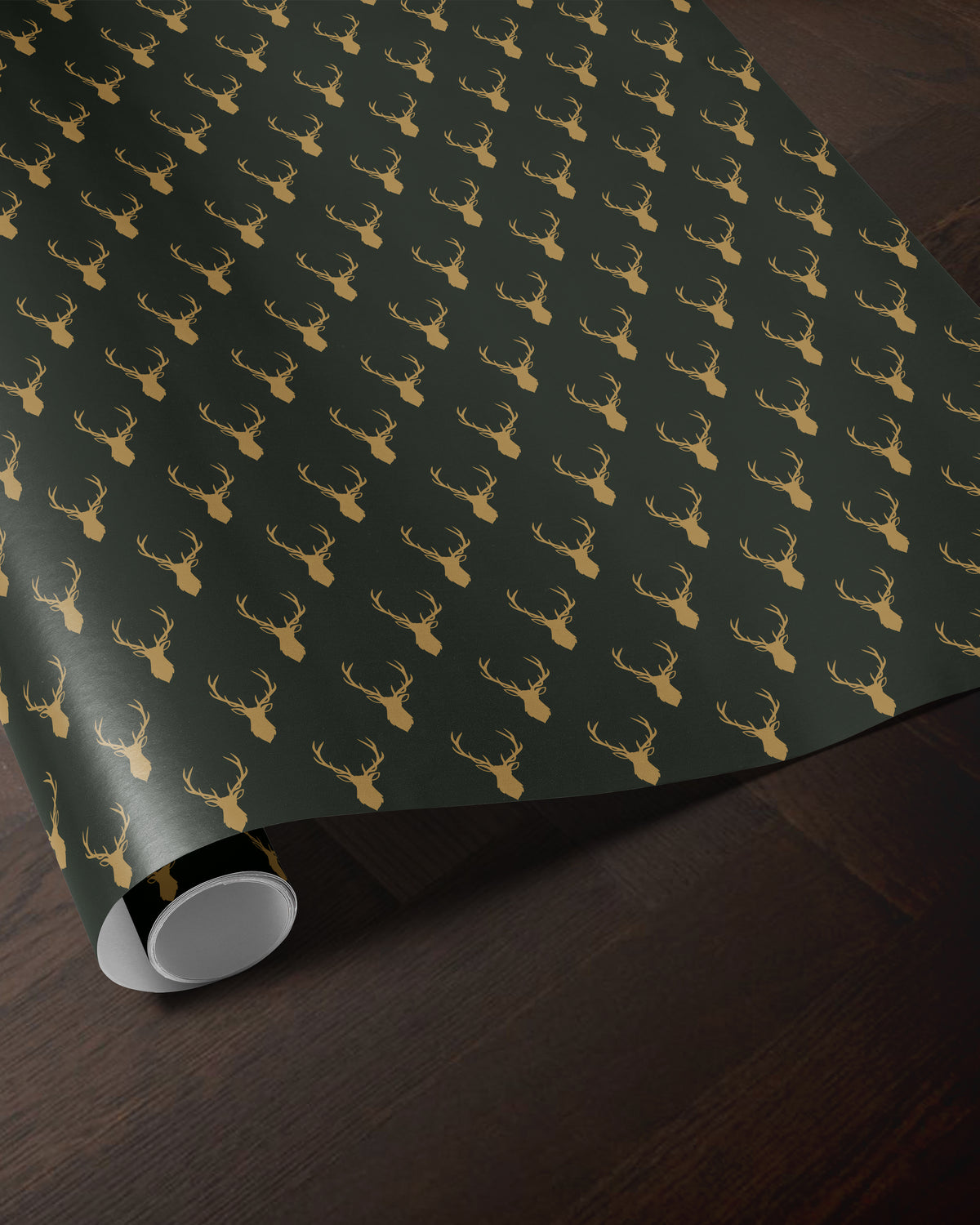 green reindeer wrapping paper roll with a golden antler pattern
