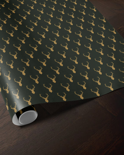 green reindeer wrapping paper roll with a golden antler pattern
