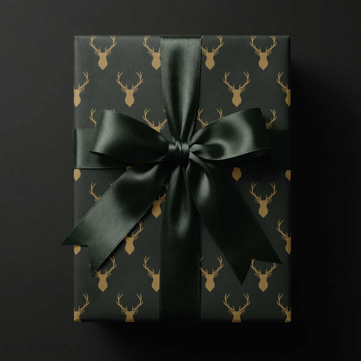 green reindeer wrapping paper featuring elegant golden antlers
