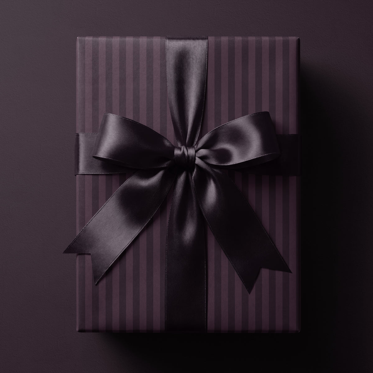 Plum striped wrapping paper featuring classic vertical stripes in rich deep tones