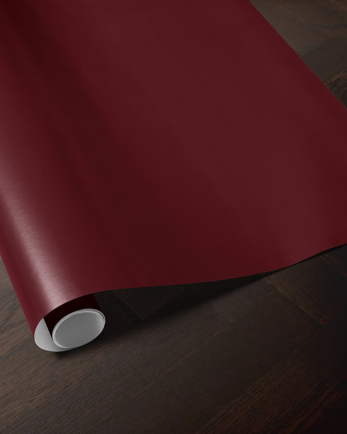 Red merlot wrapping paper roll showing the deep solid red color and smooth paper finish