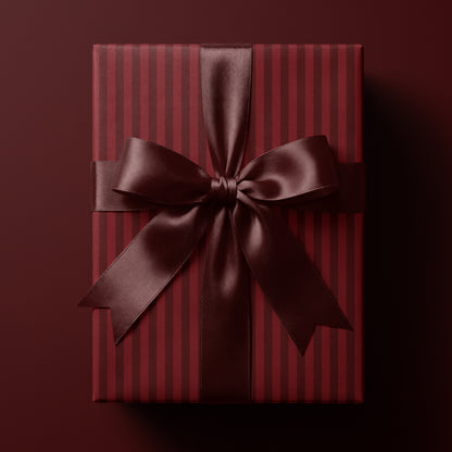 Red striped wrapping paper featuring classic vertical stripes in rich deep tones
