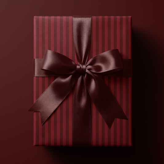 Red striped wrapping paper featuring classic vertical stripes in rich deep tones
