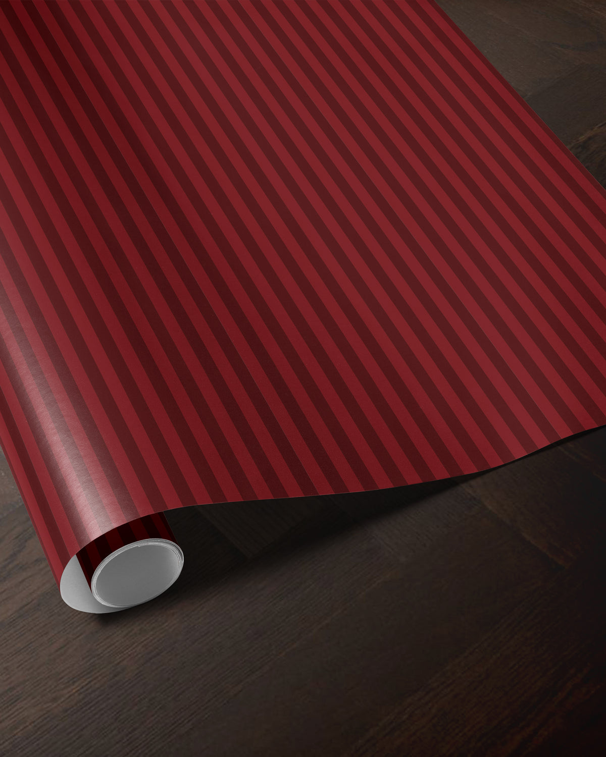 Red striped wrapping paper roll showing the classic vertical stripe pattern