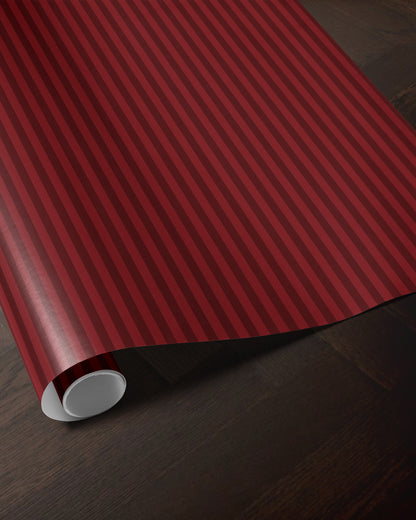 Red striped wrapping paper roll showing the classic vertical stripe pattern