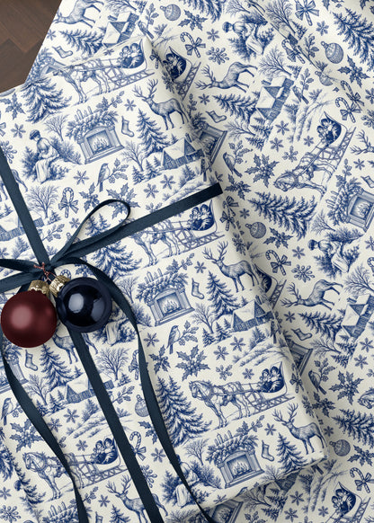 Close-up of blue woodland toile wrapping paper showing the detailed woodland scene